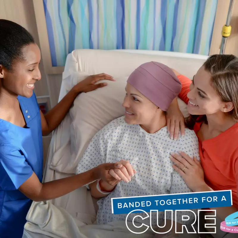 A cancer survivor with a nurse and friend