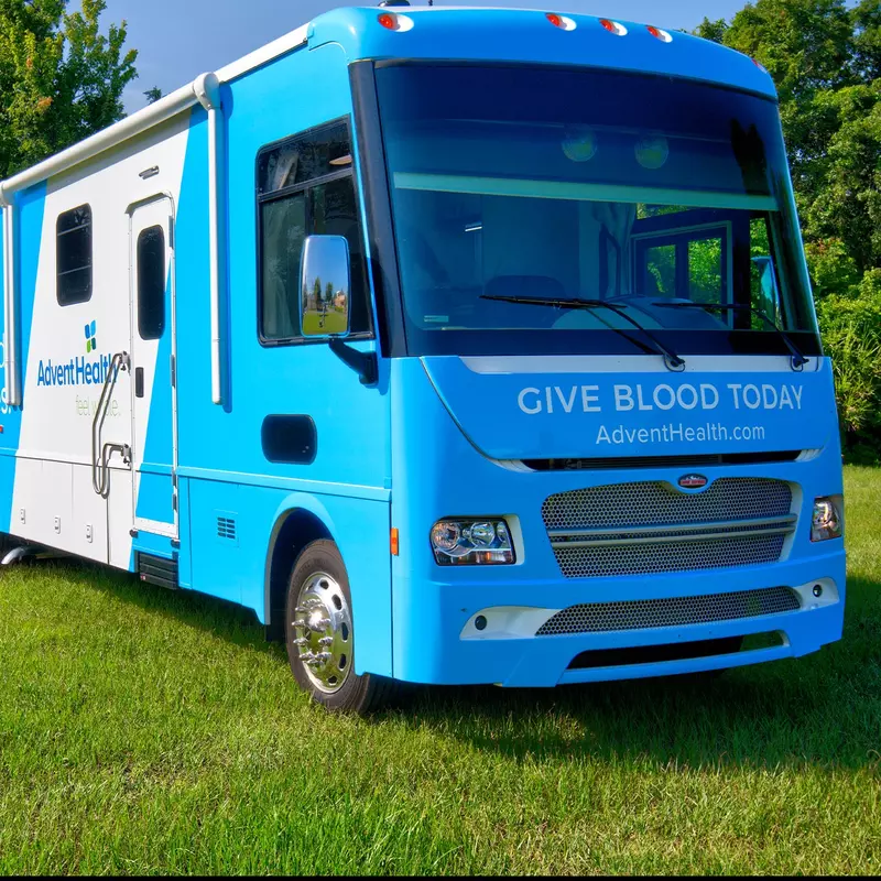 AdventHealth Bloodmobile outside on the grass.