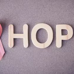 breast cancer logo next to the word hope