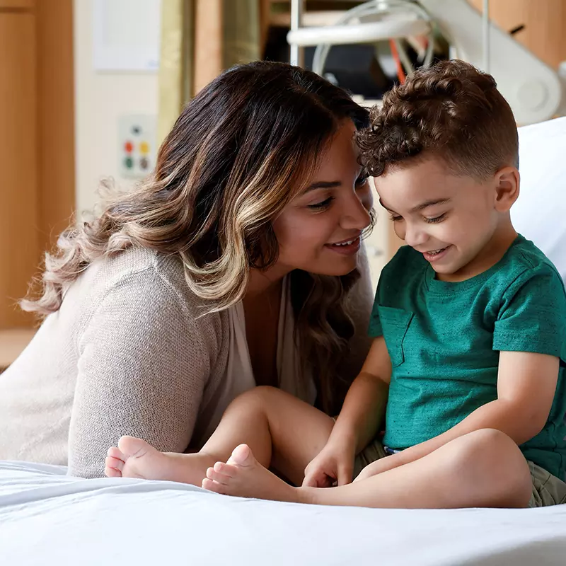 adventhealth for children day of giving, child patient in bed with mother