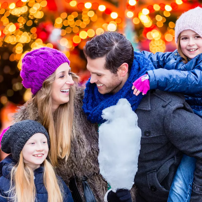 A family at a Christmas festival.