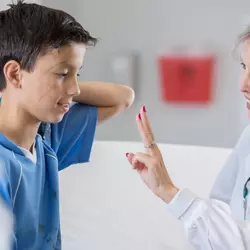 Physician checking patient's health.