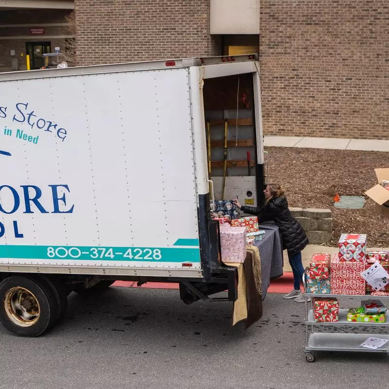 People loading a truck with donations