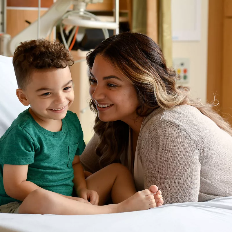 A photo of a mother and child smiling