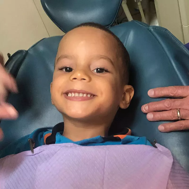 a child in a dentist's chair