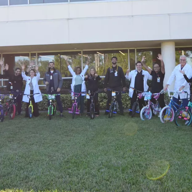 Doctors pose with bikes