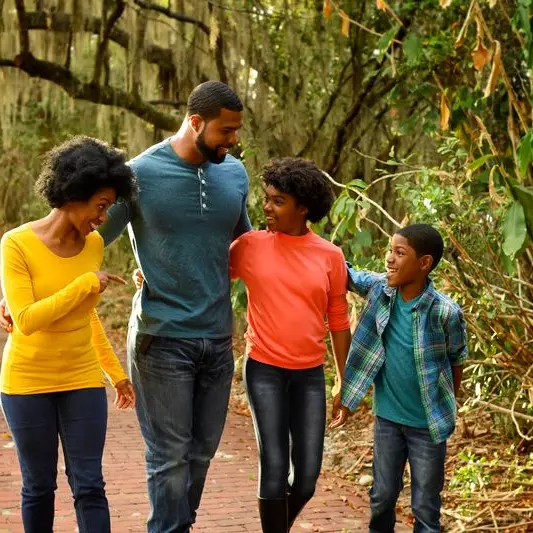 A family goes for a nature walk