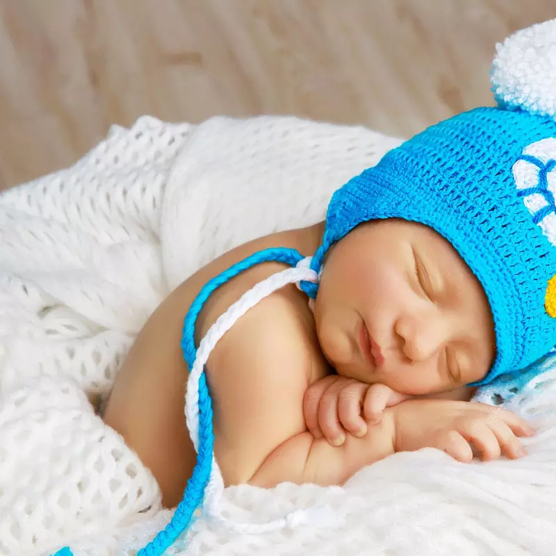 Newborn baby with blue hat