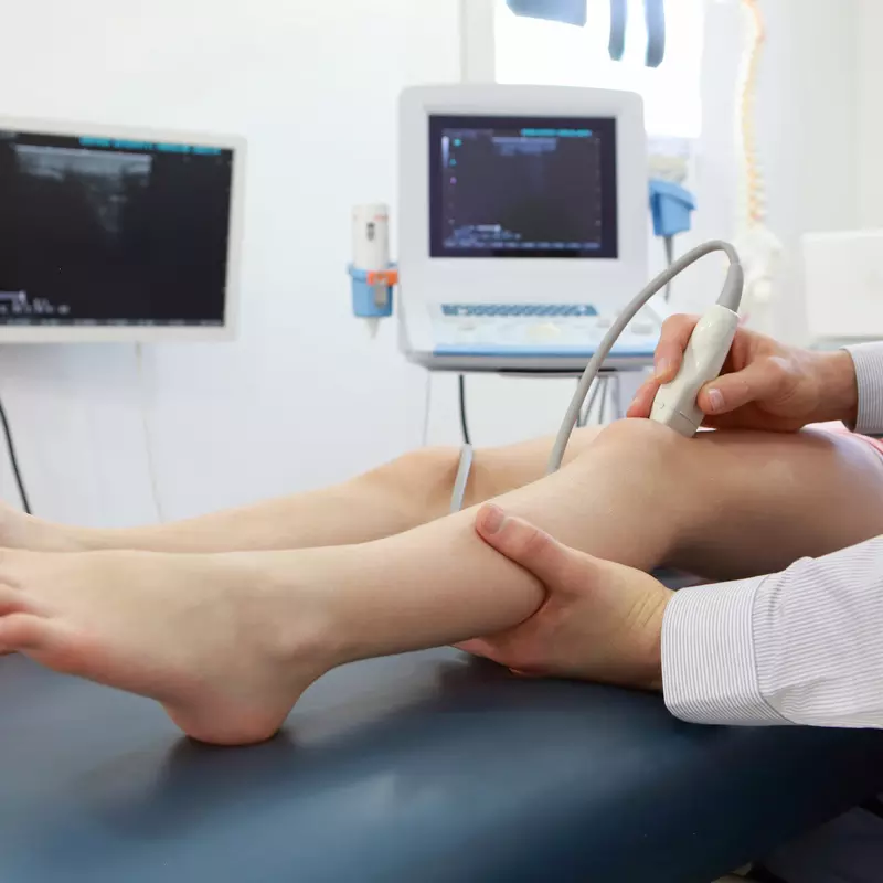 Child receiving knee ultrasound