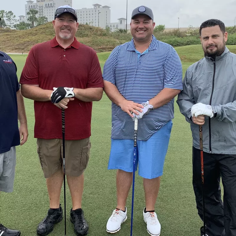 Four happy players at the AdventHealth Golf Classic