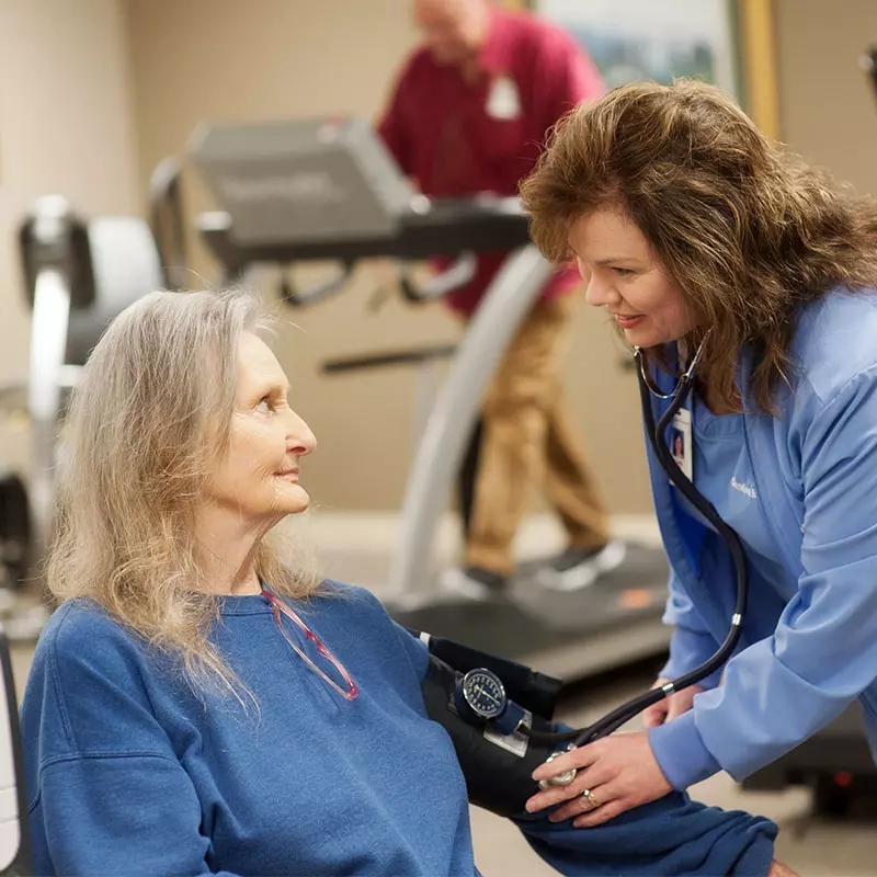 nurse with patient during cardiac rehab