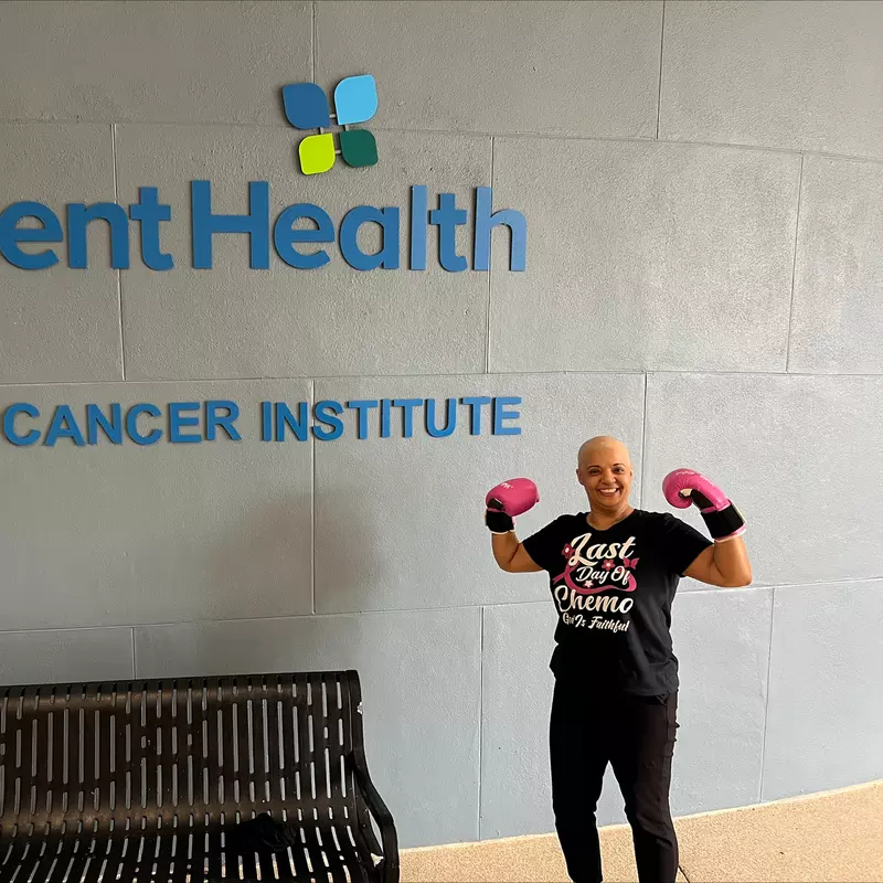 Gracie poses outside the AdventHealth Cancer Institute