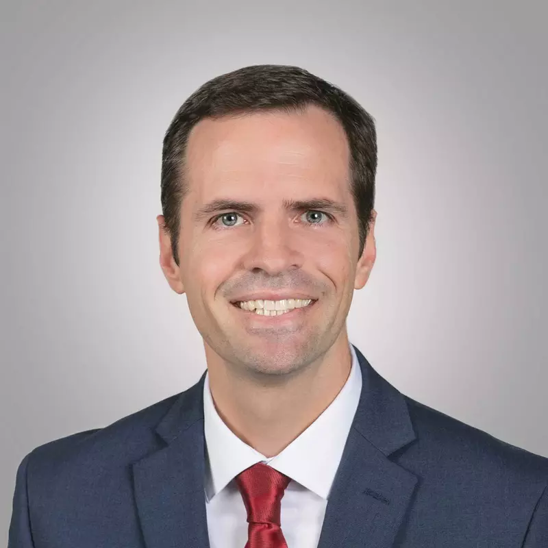 A professional headshot of Heart of Florida Vice President and Chief Financial Officer, Justin Hengesbach
