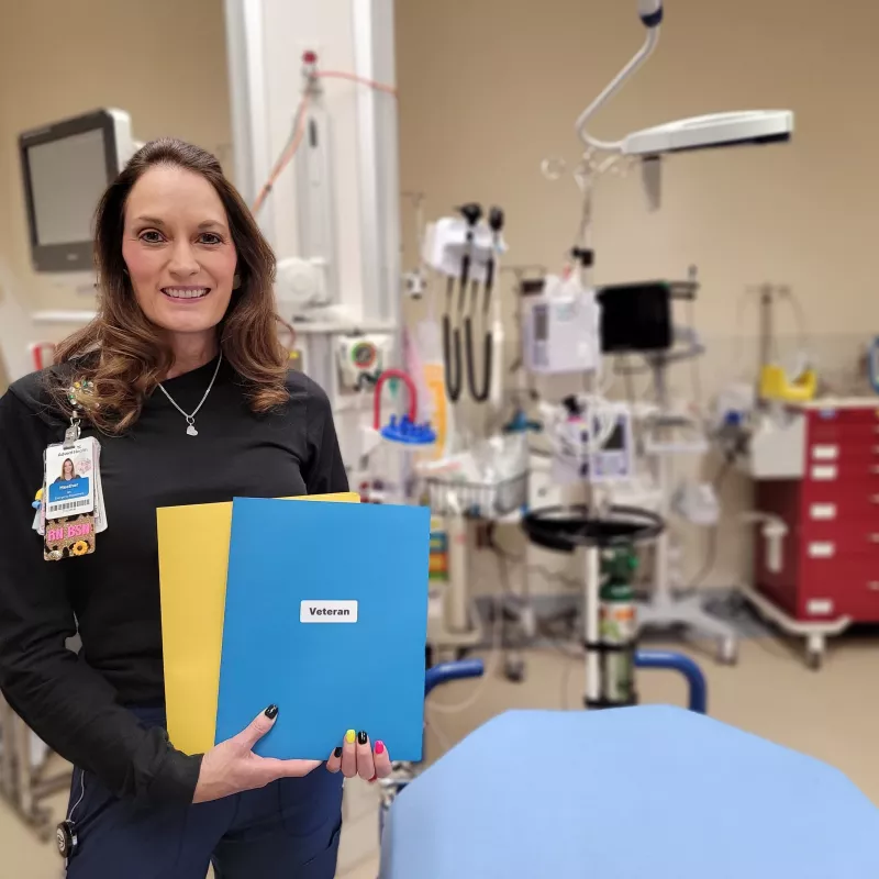 Nurse Heather Foucault stands in a patient room at AdventHealth Parker