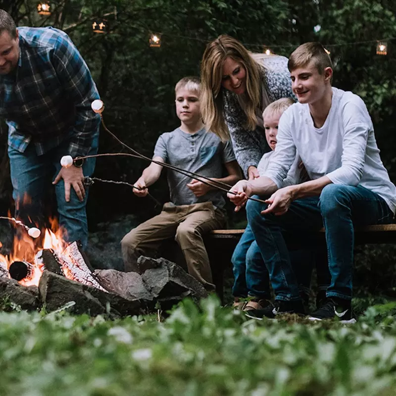 A family by a campfire.