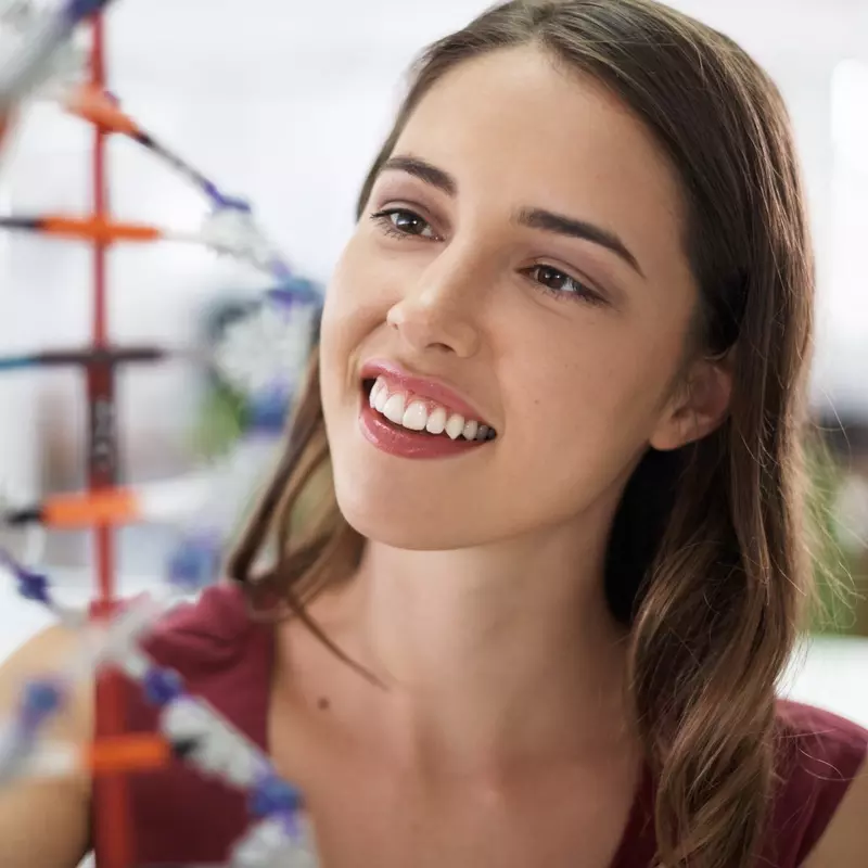 A woman studies DNA.