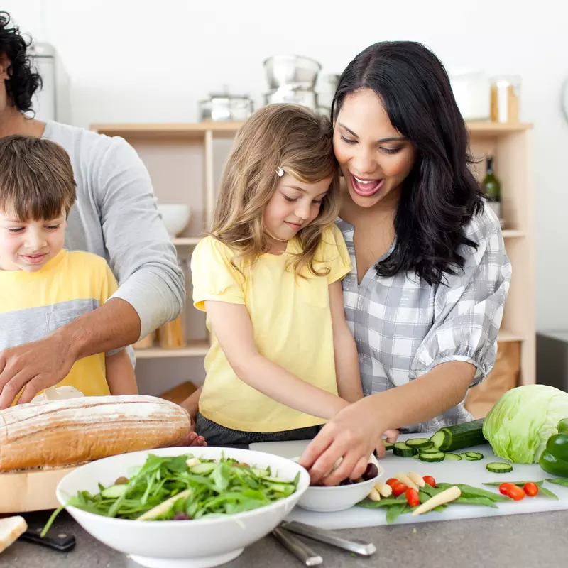 A family preparing a healthy meal.