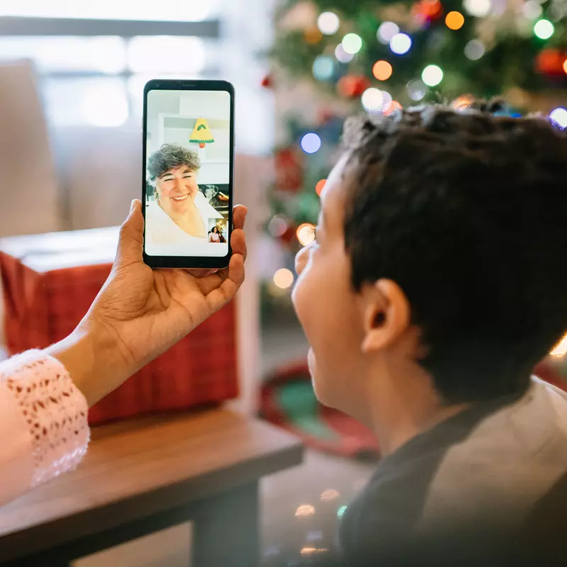 A child video chatting during the holidays.