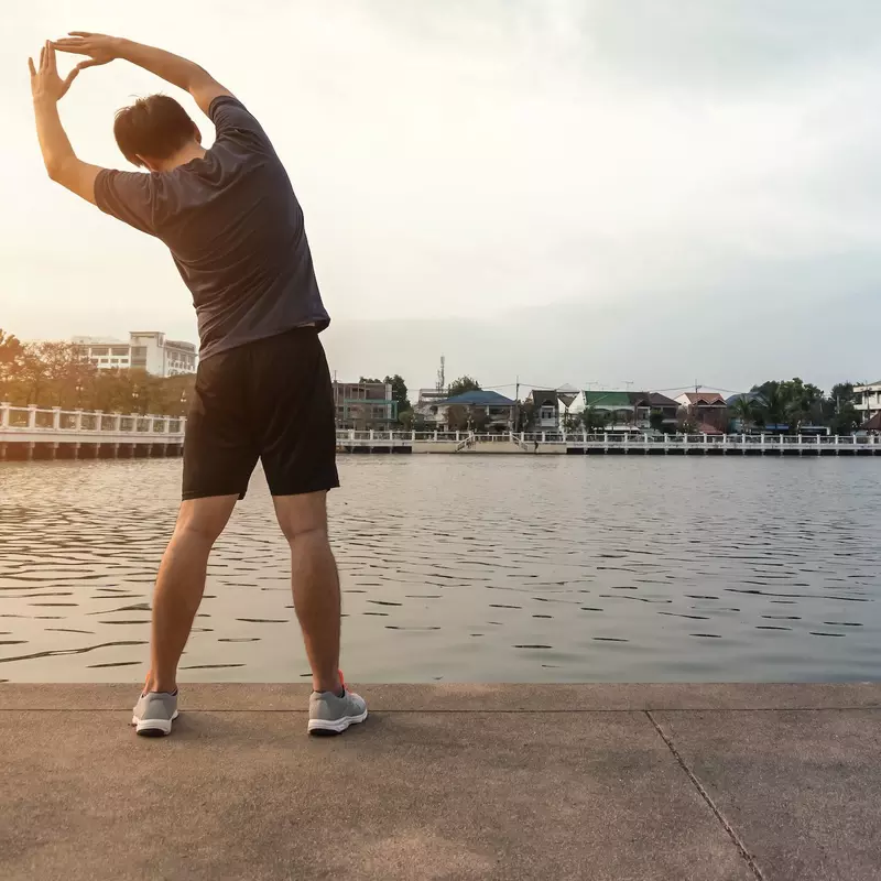 A man stretching before a run. 