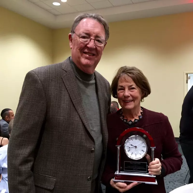 Award winner, Mary Gollier, with her clock trophy