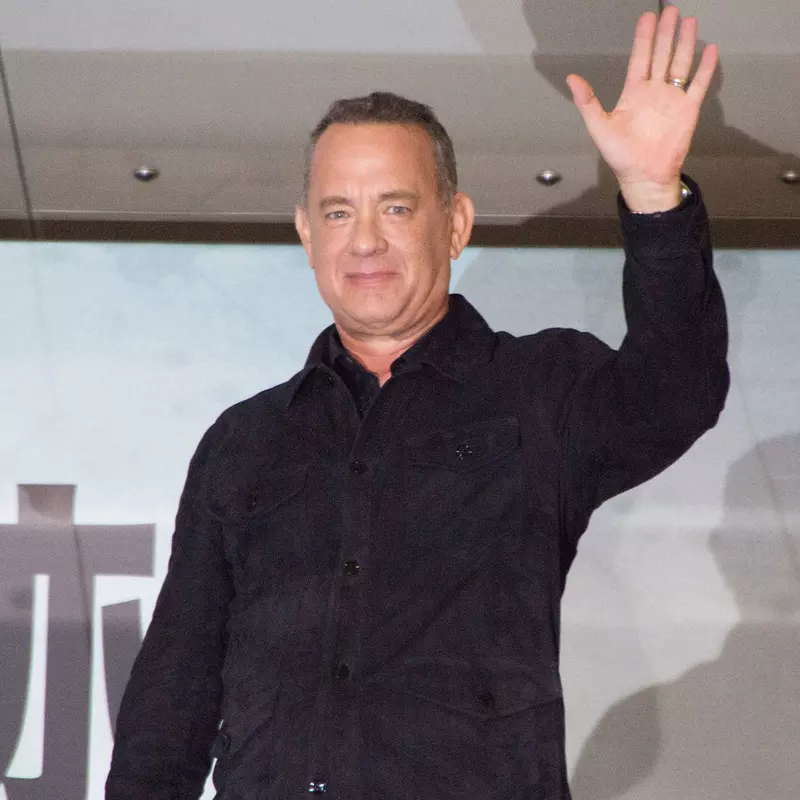Tom Hanks waves to the crowd.