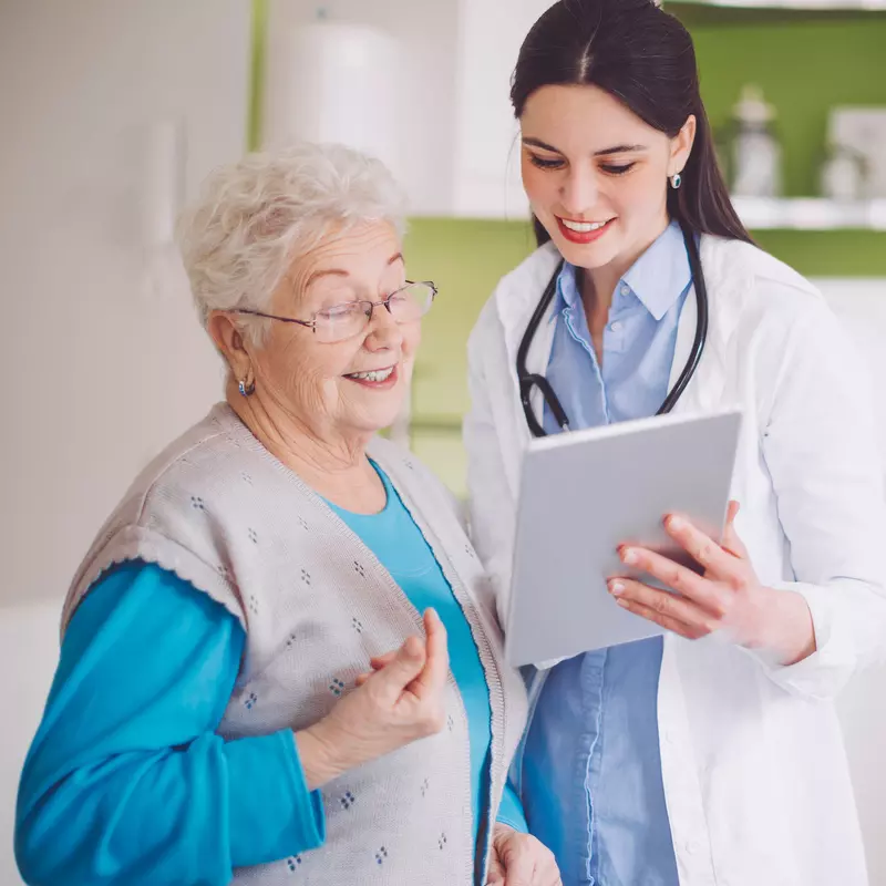 Senior patient reviewing a chart with her doctor
