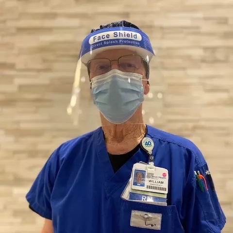 Bill Washburn, 76, RN, has worked at Texas Health Huguley Hospital Fort Worth South since it opened in 1977. Today, he helps administer COVID-19 vaccines at the onsite clinic.
