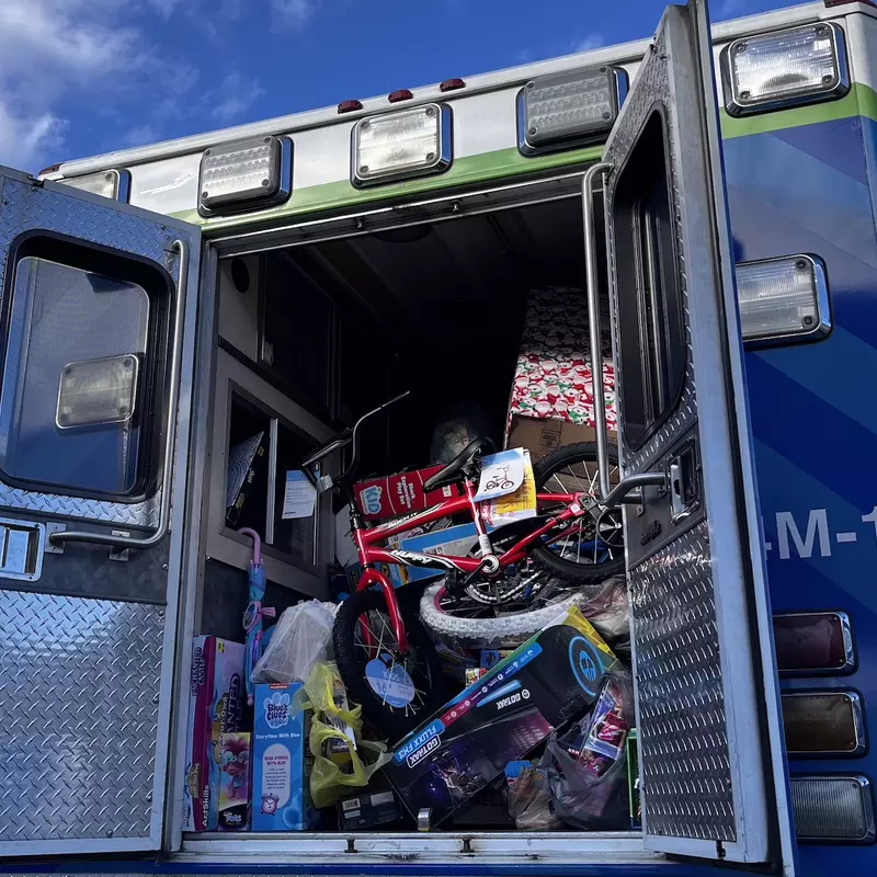 an ambulance is packed with toys ready for children.