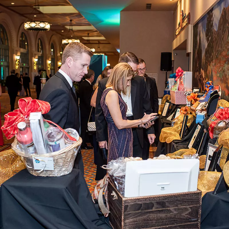 a photo of the auction table at the golden gala