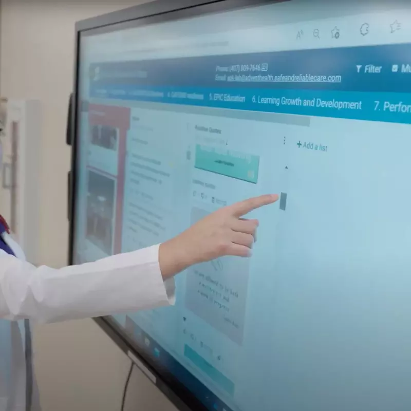 Nurse using LENS touchscreen board