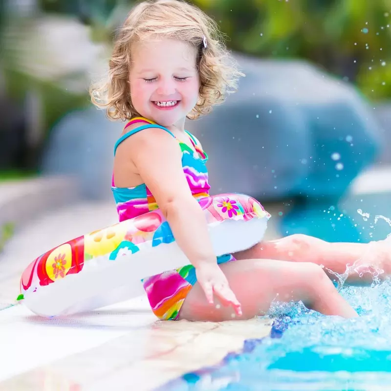 Little girl swimming in pool