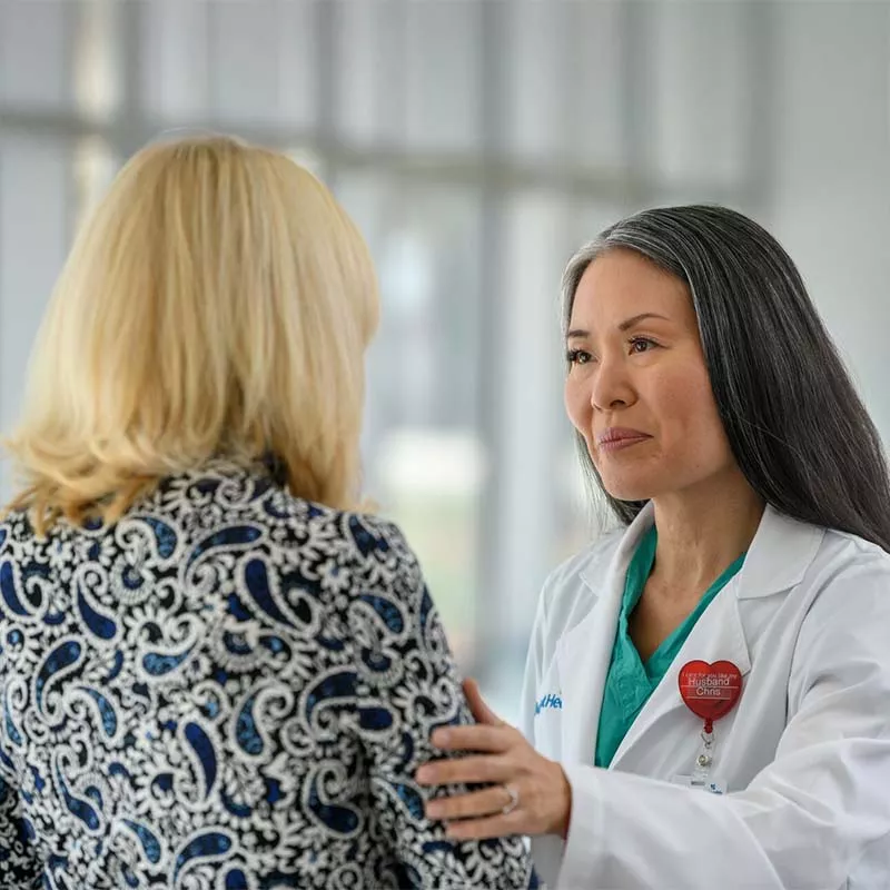 Female AdventHealth doctor speaking with a woman