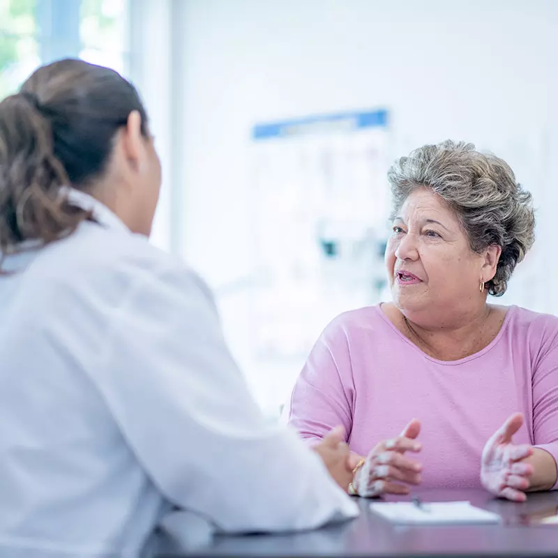 Doctor and older woman patient Talking