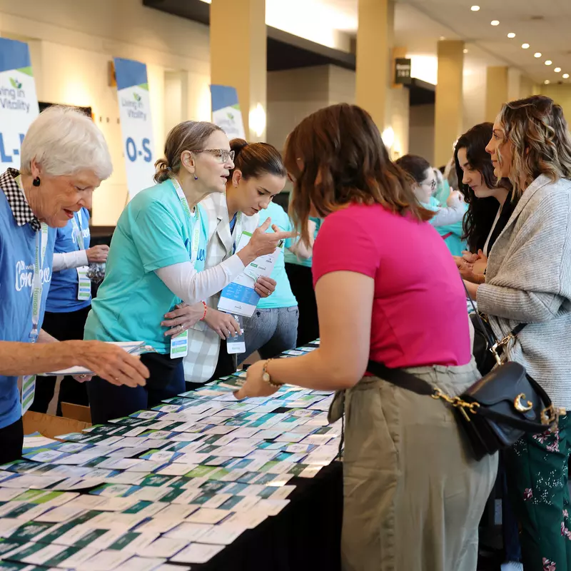 LIV attendees are helped by volunteers during the 2023 conference