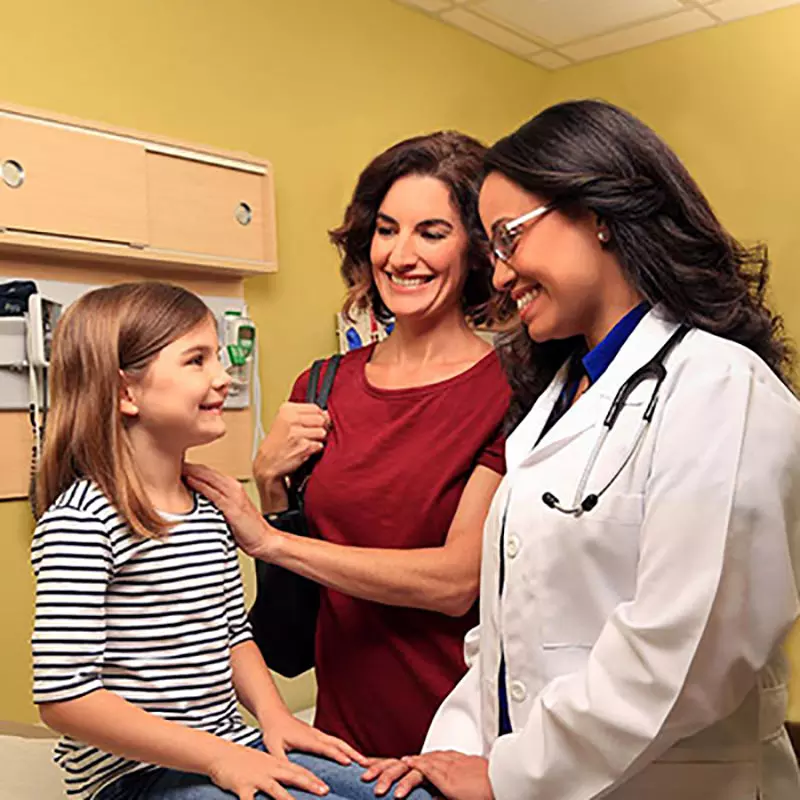 Daughter at a doctor's appointment with her mother.