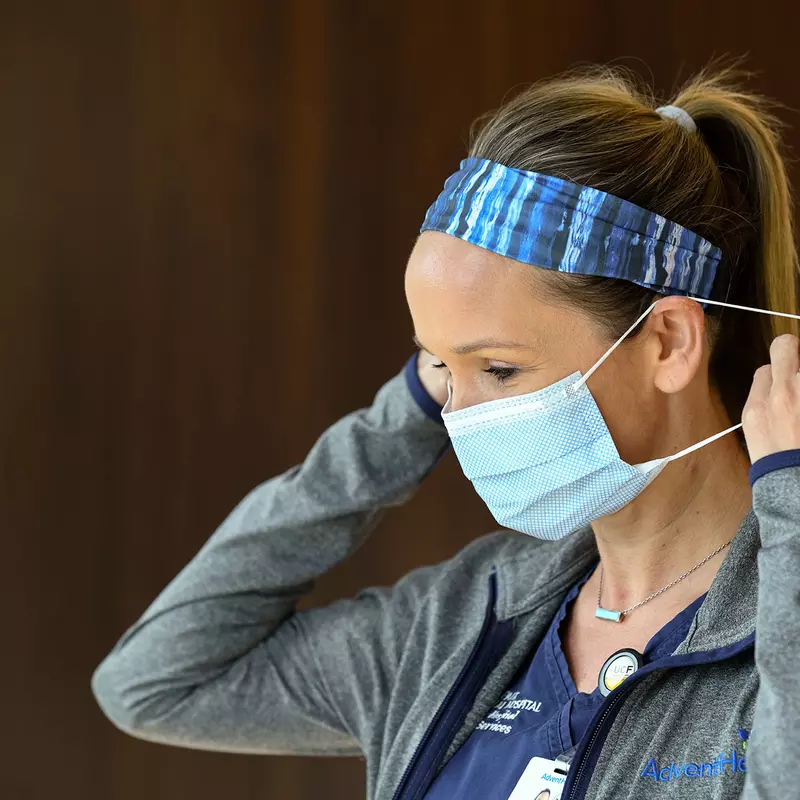 A nurse wearing a mask