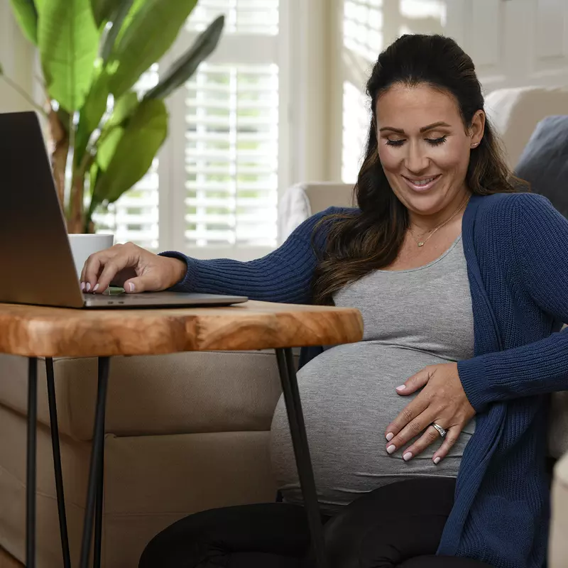 Pregnant woman using a laptop
