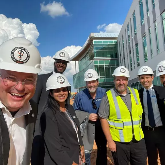 Dr. Robert Hasty, dean and chief academic officer for the new Orlando College of Osteopathic Medicine, gives a personal tour of the new facility going up in Winter Garden to AdventHealth University leaders.