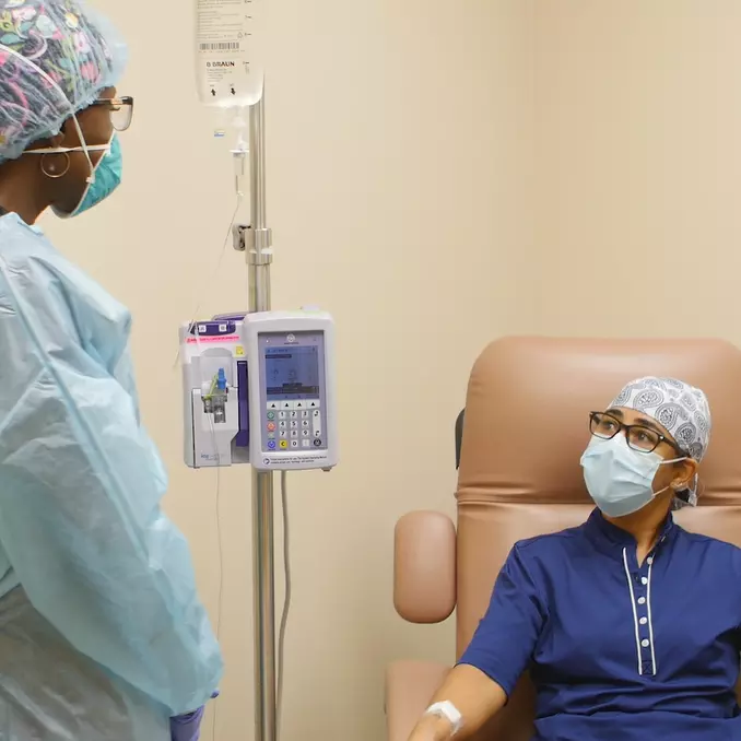 clinical employee speaks to a patient reviving a bamlanivimab infusion in Ornage City