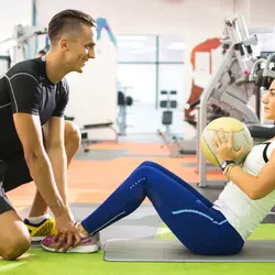personal trainer working with his client