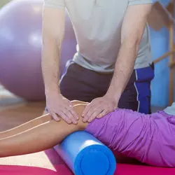 Physical therapist performing therapy on a patient