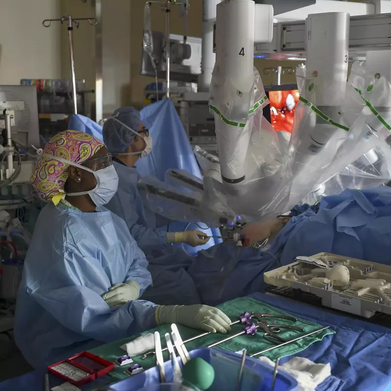 Vipul Patel and his team using robotics during surgery.