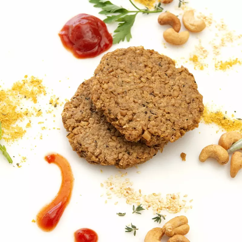 Two homemade cashew and oat-based patties