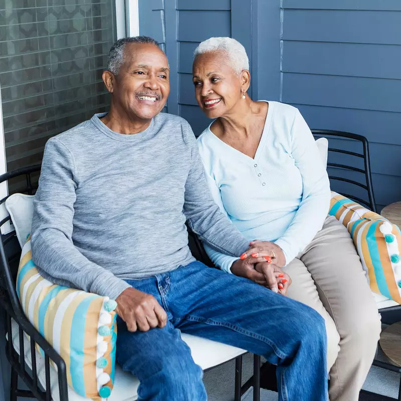 A senior couple out on their porch