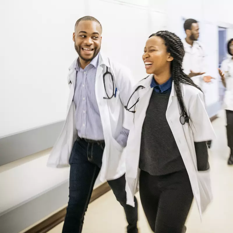 Medical students walking down a hallway.