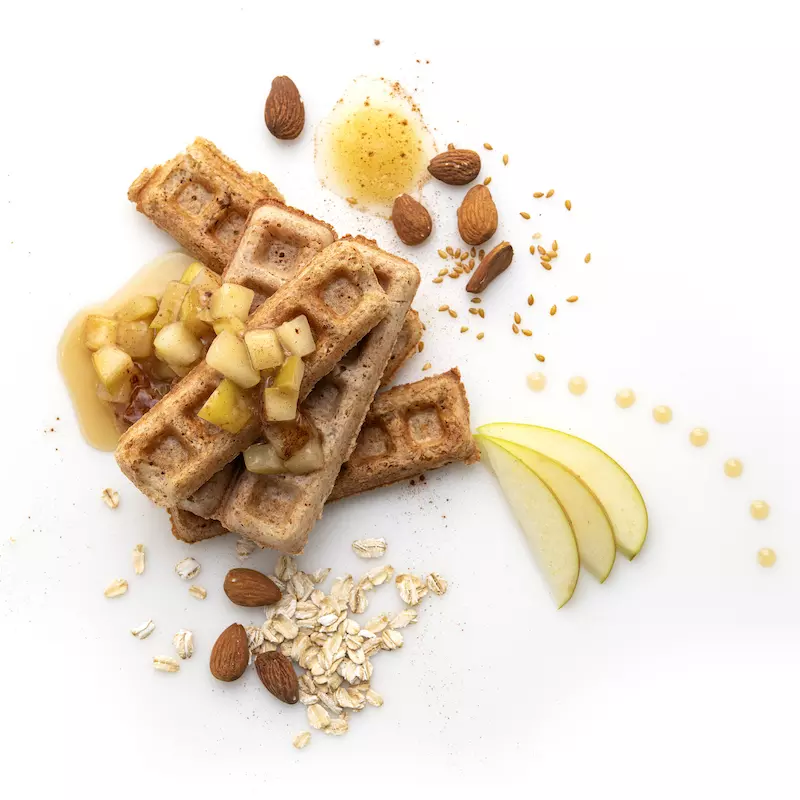 Waffle strips with apple and almond garnishes