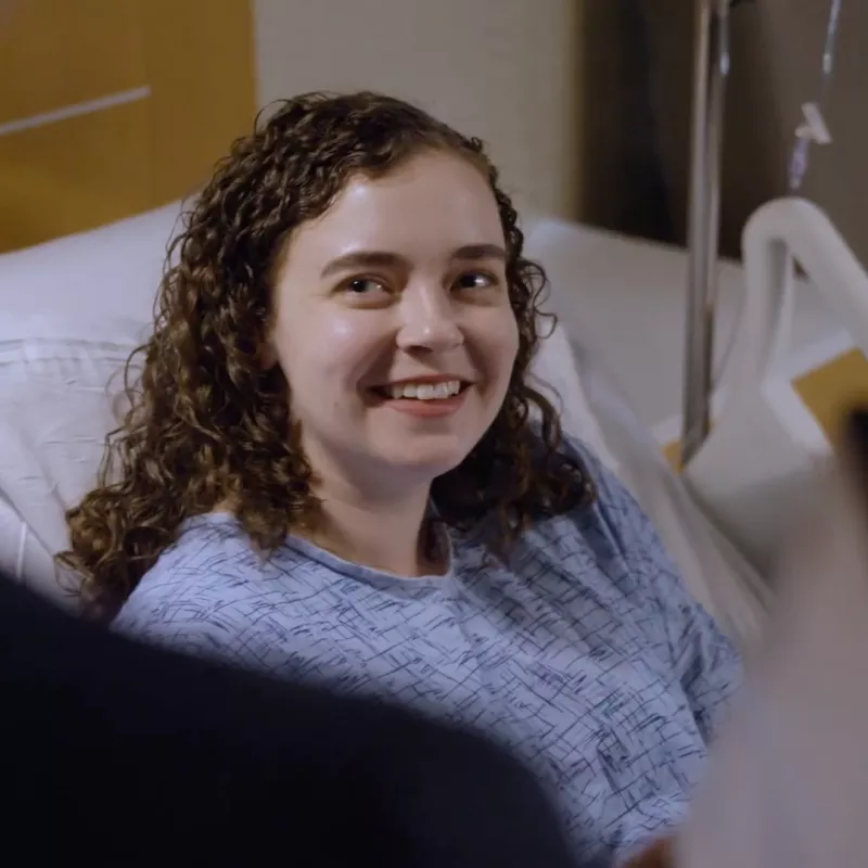 An AdventHealth Translational Research Institute Patient Smiles at an Off Camera Provider