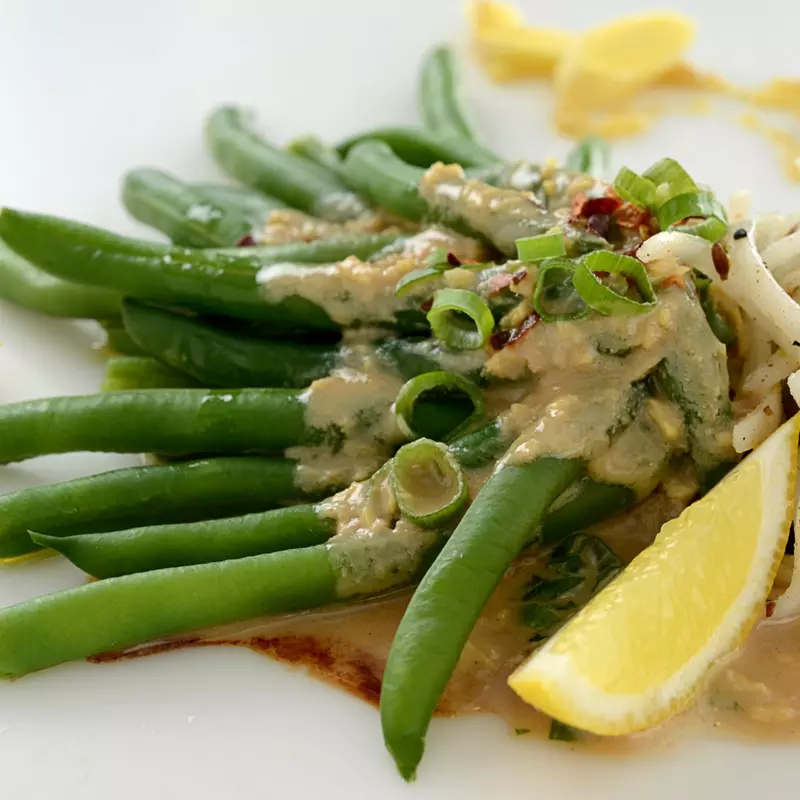 Vegetable dish with tahini and honey infused green beans