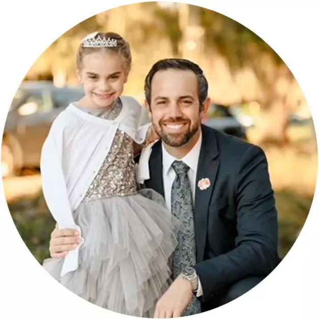 a man and a child dressed up for an event
