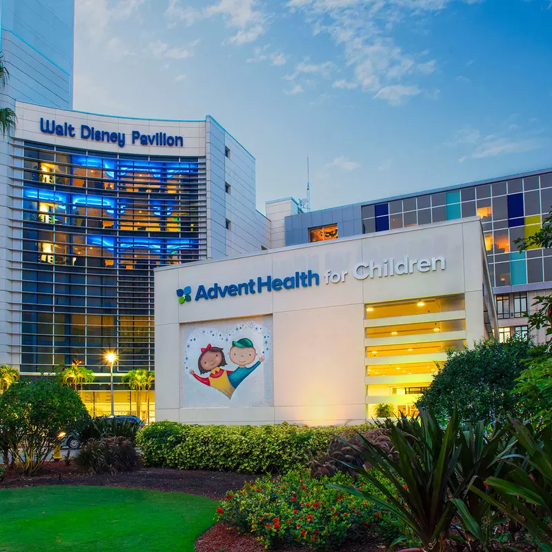Photo at dusk of the front facade of Walt Disney Pavilion at AdventHealth for Children.